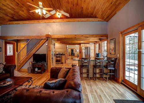 a living room with a couch and a table at Incredible Lakeside Cabin Rental Situated near Walker Bay in Minnesota in Ah-gwah-ching