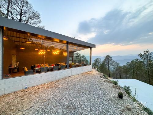 a house with a view of the mountains at Anupraas Resort in Lansdowne