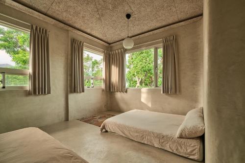 Katil atau katil-katil dalam bilik di Six Lands homestay