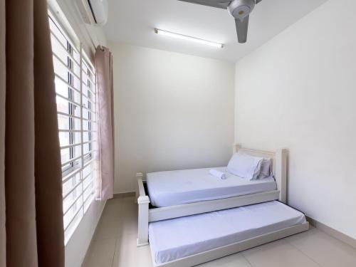 Кровать или кровати в номере Puncak Alam 3 Bdroom, Eco Grandeur, Uitm, Netflix
