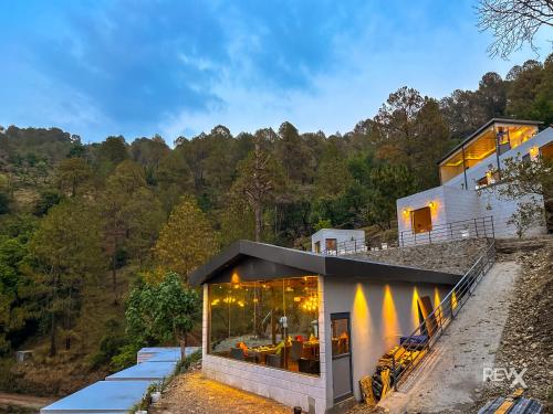a house on the side of a hill at Anupraas Resort in Lansdowne