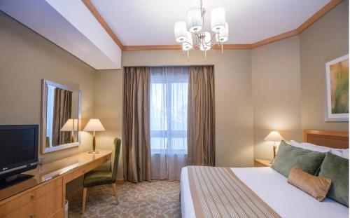 Un ou plusieurs lits dans un hébergement de l'établissement TIME Ruby Hotel Apartment