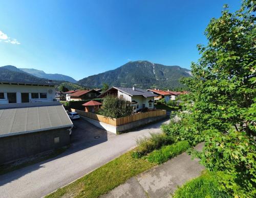 arial view of a village with houses and mountains at Haus Gaichtspitzblick in Weissenbach am Lech