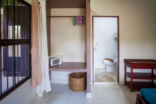 a bathroom with a toilet and a sink in a room at House 4 people sea view 100 m from the beach in Klong Muang Beach