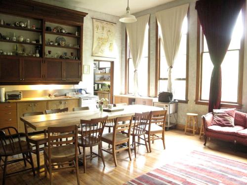 a kitchen with a table and chairs and a couch at Historic Vacation Rental with Music Studio in the Catskills near Hancock, New York in Hancock