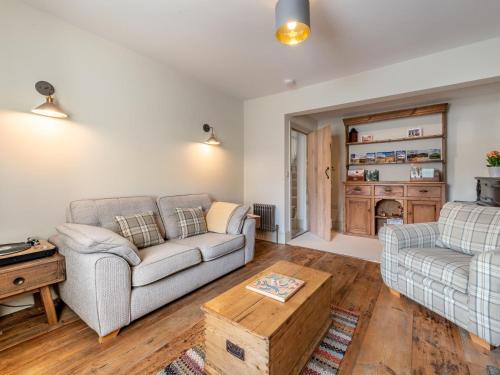 a living room with two couches and a coffee table at 4 bed in Crickhowell 85242 in Crickhowell