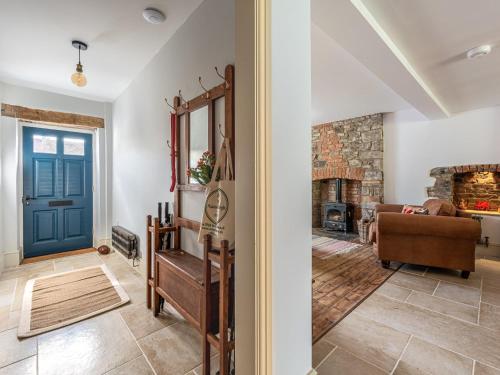 a living room with a blue door and a couch at 4 bed in Crickhowell 85242 in Crickhowell