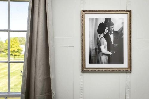 a picture of a man and a woman on a wall at Elegant Historic Suite with Mountain Views in Luray, Virginia in Luray