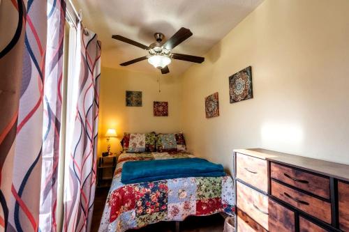 a bedroom with a bed and a ceiling fan at Quaint Cozy Cottage Perfect for a Peaceful Getaway in West Virginia in Pipestem