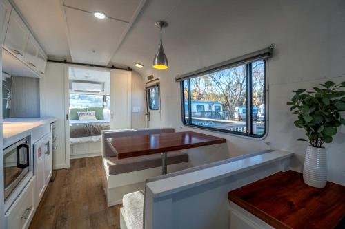 an rv kitchen with a sink and a window at Wagon Circle Unit in Prescott, AZ in Prescott