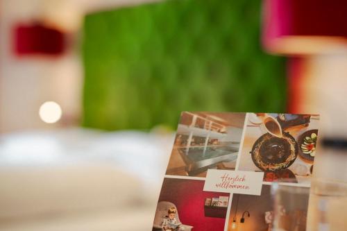 a card with a picture of food on a table at Hotel Stäfeli in Lech am Arlberg