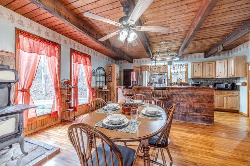 a kitchen and dining room with a table and chairs at Serene Cabin with Hot-Tub in Cleveland, Georgia in Kinseytown