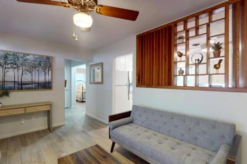 a living room with a couch and a window at Remodeled Mid-Century Home Near Downtown & Hwy 6 in College Station, Texas in Navasota