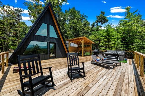 a wooden deck with chairs and a gazebo at Modern A-Frame Cabin with Breathtaking Views of the Smoky Mountains, Perfect for Families or Groups in Hartford