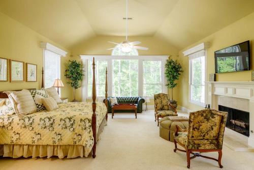 a bedroom with a bed and a fireplace at Incredible Villa Rental for Groups with Pool near Mt Vernon, Texas in Hopewell