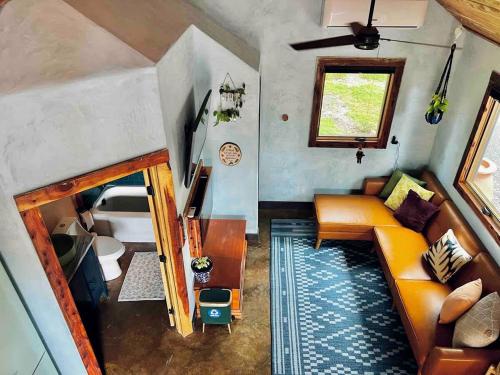 an overhead view of a living room with a couch at Charming Pet-Friendly Cabin with Stunning Mountain Views in Chattanooga, Tennessee in Whitwell
