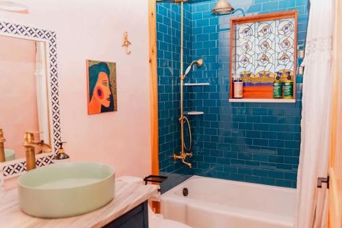 a bathroom with a tub and a sink at Charming Pet-Friendly Cabin with Stunning Mountain Views in Chattanooga, Tennessee in Whitwell