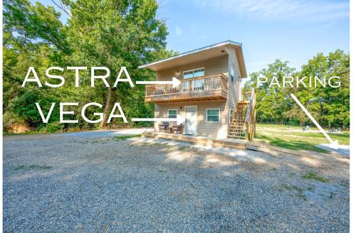 a house on a gravel road with the words austriazazaza parking at Off-Grid Tiny House with Fire Pit and Countryside Views in Tennessee in Parrottsville