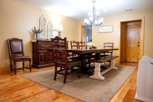 a dining room with a table and chairs at Fantastic Cabin with Fire Pit, Hot-tub and Fireplace in Sautee Nacoochee, Georgia in Aerial