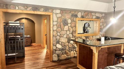 a kitchen with a stone wall with a counter top at Fantastic Cabin with Fire Pit, Hot-tub and Fireplace in Sautee Nacoochee, Georgia in Aerial