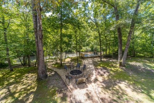 an overhead view of a park with a table and chairs at Fantastic Cabin with Fire Pit, Hot-tub and Fireplace in Sautee Nacoochee, Georgia in Aerial