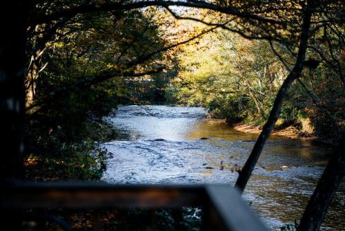 a view of a river from the top of a vehicle at Fantastic Cabin with Fire Pit, Hot-tub and Fireplace in Sautee Nacoochee, Georgia in Aerial