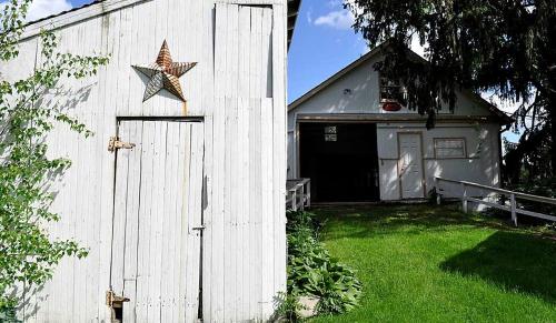 a star on the side of a white barn at Private Bed and Breakfast Accommodation for Two near Doylestown, Pennsylvania in Buckingham