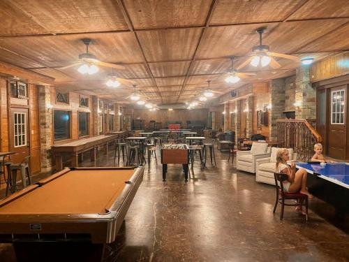 a large room with a pool table and tables at Rest and Relax in Texas in this Great Safari Tent Getaway in Cibolo in Marion