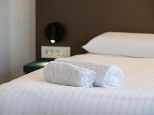 B&B HOTEL Maribor Orelにあるベッド