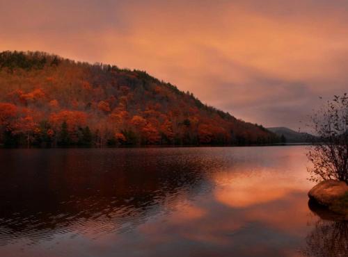 a view of a lake with a mountain in the background at Delightful Guest House Cabin in the Adirondacks in North River