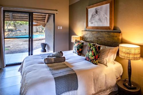 Katil atau katil-katil dalam bilik di Sable Ranch Bush Lodge