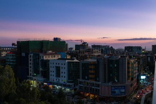 a view of a city at night at Daisy Hotel in Addis Ababa