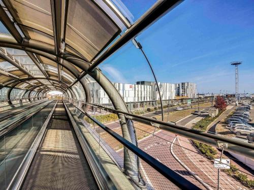 a view of a train station from a window at ibis Paris Coeur d'Orly Airport in Orly