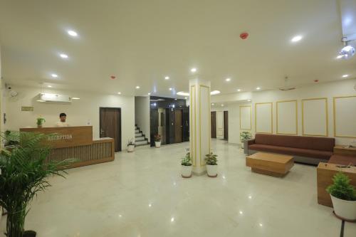 a lobby of a hospital with a reception desk at Jeel Pearl Hotel in Udaipur