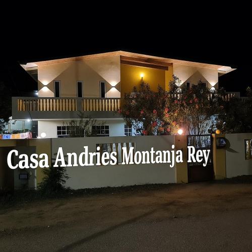 a building with a sign that reads casa and cities montmartinian key at Casa Andries Montanja Rey in Willemstad
