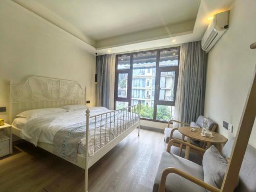 Postel nebo postele na pokoji v ubytování Shanju Bieyuan Homestay (Yangshuo Yulonghe Branch)