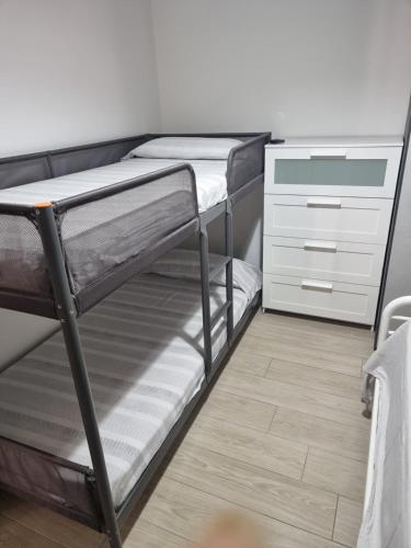 Ένα ή περισσότερα κρεβάτια σε δωμάτιο στο Rosy Vacation Home