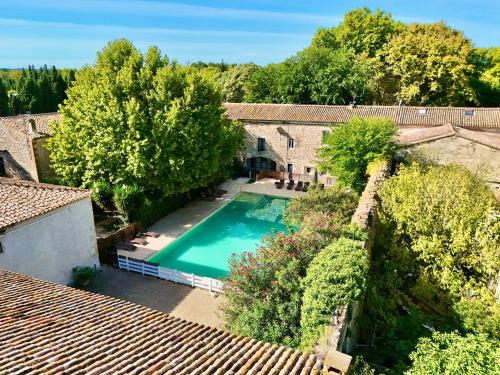 an overhead view of a house with a swimming pool at Hotel Le Galambre in Nîmes
