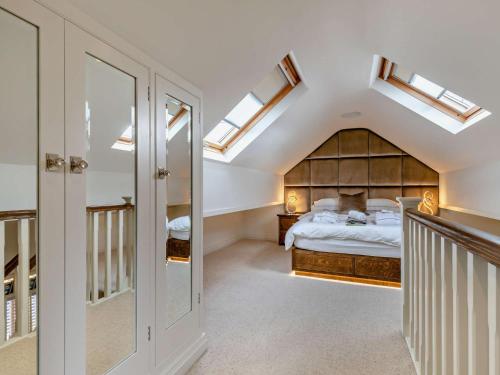 a bedroom with a bed and skylights at 1 Bed in Alderwasley 94394 in Alderwasley