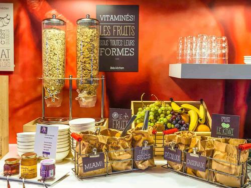 a display of fruits and vegetables on a table at ibis Toulouse Centre in Toulouse