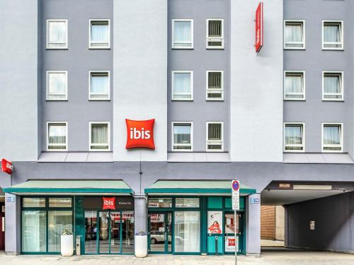 a large building with a ups sign in front of it at ibis Hotel München City in Munich