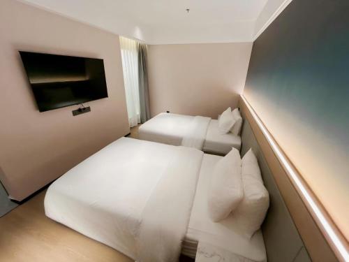 Chongqing Tangtuan Hotelにあるベッド