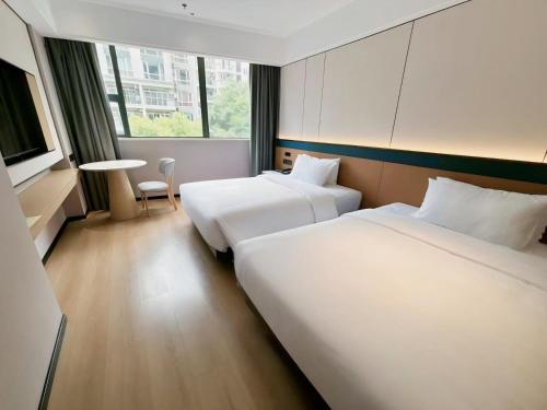 Chongqing Tangtuan Hotelにあるベッド