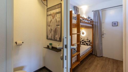 a room with two bunk beds and a bathroom at Balcons du soleil II A N 53 - ST4 in Germ