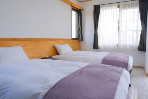 En eller flere senge i et værelse på Blue Ocean Resort