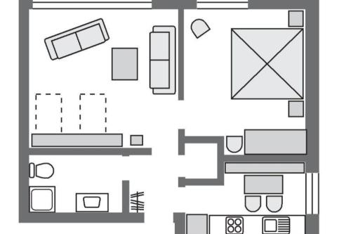 a floor plan of a house with furniture at Marbijes Appartementhaus in Cuxhaven