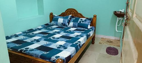 Postel nebo postele na pokoji v ubytování Sri Sai rooms