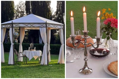 a table with a gazebo with candles and a table with a table at La Palazzina in Val d'Orcia in Radicofani