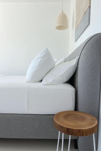 a living room with a couch and a table at Gloria Luxury Suites in Kallithea Halkidikis