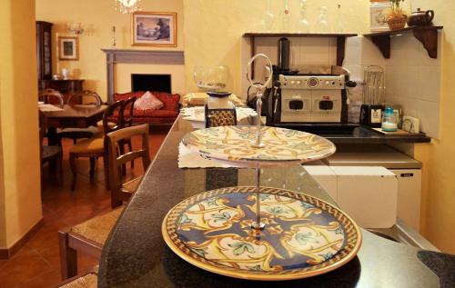a kitchen with a counter with two plates on it at La Palazzina in Val d'Orcia in Radicofani